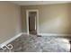 Bright room with tile flooring, neutral walls, and an open doorway at 822 W 7Th St, Muncie, IN 47302