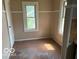 Small empty room featuring neutrally colored walls at 822 W 7Th St, Muncie, IN 47302