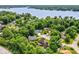 Aerial view of a neighborhood, showcasing lake access, and lush tree coverage at 8534 Helmsman Cir, Indianapolis, IN 46256