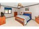 A quaint bedroom with striped wallpaper and light-blocking curtains at 8534 Helmsman Cir, Indianapolis, IN 46256