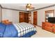 This cozy bedroom is decorated with striped wallpaper and vintage furniture at 8534 Helmsman Cir, Indianapolis, IN 46256