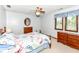 This bedroom offers wood furniture and a ceiling fan at 8534 Helmsman Cir, Indianapolis, IN 46256