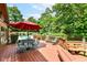 Outdoor deck featuring patio furniture and a view of the backyard pool and landscaping at 8534 Helmsman Cir, Indianapolis, IN 46256
