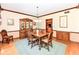 Dining room featuring hardwood floors, classic furniture, and access to other living spaces at 8534 Helmsman Cir, Indianapolis, IN 46256