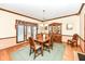 Traditional dining room with hardwood floors, a large window, and a classic china cabinet at 8534 Helmsman Cir, Indianapolis, IN 46256