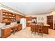 Open kitchen layout with wood cabinets, island seating, and modern appliances at 8534 Helmsman Cir, Indianapolis, IN 46256