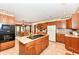 Spacious kitchen with center island, wood cabinets, and breakfast area at 8534 Helmsman Cir, Indianapolis, IN 46256