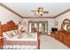 This spacious main bedroom features a bay window and wood furniture at 8534 Helmsman Cir, Indianapolis, IN 46256