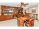 Home office showcasing a large built-in bookcase and wood desk at 8534 Helmsman Cir, Indianapolis, IN 46256