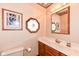 Half bath featuring a vanity with marble countertop and decorative wall accents at 8534 Helmsman Cir, Indianapolis, IN 46256
