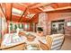 Cozy sunroom with brick fireplace, skylights, and comfortable seating at 8534 Helmsman Cir, Indianapolis, IN 46256