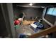 Unfinished basement with black painted walls, drop ceiling and exercise equipment at 917 N Rural St, Indianapolis, IN 46201