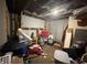 Unfinished basement with exposed beams and available storage space at 917 N Rural St, Indianapolis, IN 46201