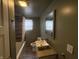 Bathroom featuring shower/tub combination, with a large mirror, and single sink vanity at 917 N Rural St, Indianapolis, IN 46201