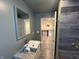Bathroom boasts tiled walls, granite countertop, and a modern sink and faucet at 917 N Rural St, Indianapolis, IN 46201