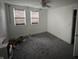Bedroom featuring carpet, multiple windows with blinds, and a ceiling fan at 917 N Rural St, Indianapolis, IN 46201