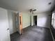 Large bedroom with a ceiling fan and multiple doors leading to other rooms at 917 N Rural St, Indianapolis, IN 46201