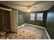 Cozy bedroom featuring carpet floors, a ceiling fan, and two windows for natural light at 917 N Rural St, Indianapolis, IN 46201