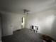 Bedroom with a ceiling fan, closet doors, and a small toy kitchen at 917 N Rural St, Indianapolis, IN 46201