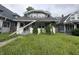 Gray two-story home with a black shingle roof and front yard at 917 N Rural St, Indianapolis, IN 46201
