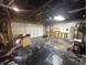 A two car garage with work bench and lots of empty floor space at 917 N Rural St, Indianapolis, IN 46201