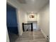 Hallway features a charming artwork and a window adding character to the home at 917 N Rural St, Indianapolis, IN 46201
