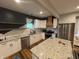 Modern kitchen with white cabinets, stainless steel appliances and a large island at 917 N Rural St, Indianapolis, IN 46201