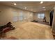 Spacious carpeted living room with wood floors and three windows at 917 N Rural St, Indianapolis, IN 46201