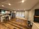 View of the open living room with kitchen and wood floors at 917 N Rural St, Indianapolis, IN 46201