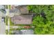 An overhead aerial shot displays the compact backyard and the layout of the property within its neighborhood setting at 1011 W 7Th St, Anderson, IN 46016