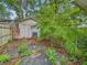 Backyard featuring a shed with mature trees and a partial fence at 1011 W 7Th St, Anderson, IN 46016