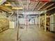 Large unfinished basement providing ample space for storage and utilities at 1011 W 7Th St, Anderson, IN 46016