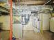 Efficient HVAC and water heater systems are shown in this home basement at 1011 W 7Th St, Anderson, IN 46016