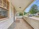 Inviting front porch offering an outdoor relaxation and neighborhood views at 1011 W 7Th St, Anderson, IN 46016