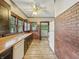 Charming kitchen with hardwood countertops, brick wall, white appliances, and ample cabinet space at 1011 W 7Th St, Anderson, IN 46016
