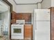 Functional kitchen features a gas range, refrigerator, and brick backsplash at 1011 W 7Th St, Anderson, IN 46016