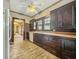 Well-lit kitchen with wood countertops, dark cabinets, white appliances, and original details at 1011 W 7Th St, Anderson, IN 46016