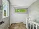 Bright mud room featuring a window, natural light, and access to the outside at 1011 W 7Th St, Anderson, IN 46016