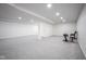 Large, finished basement featuring gray carpeting, white walls, and recessed lighting at 1015 Fox Hill Dr, Indianapolis, IN 46228