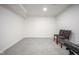 Well-lit finished basement with gray carpet, offering potential as flex space at 1015 Fox Hill Dr, Indianapolis, IN 46228