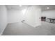 Finished basement with neutral carpet, white walls, and stairs to the main floor at 1015 Fox Hill Dr, Indianapolis, IN 46228
