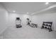 Spacious finished basement featuring fitness equipment, including a treadmill and weights at 1015 Fox Hill Dr, Indianapolis, IN 46228