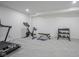 Bright basement space features a treadmill, stationary bike and weight equipment at 1015 Fox Hill Dr, Indianapolis, IN 46228