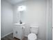 Bathroom featuring modern fixtures, including a new toilet and sink with vanity at 1015 Fox Hill Dr, Indianapolis, IN 46228