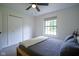 Cozy bedroom with a comfortable bed, soft carpet, and ample natural light at 1015 Fox Hill Dr, Indianapolis, IN 46228
