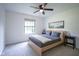 Minimalist bedroom featuring natural light, modern decor, and a comfortable bed at 1015 Fox Hill Dr, Indianapolis, IN 46228