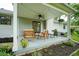 Cozy covered patio with neutral furniture and outdoor lights perfect for outdoor relaxation and entertaining at 1015 Fox Hill Dr, Indianapolis, IN 46228