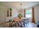 Bright dining room with modern chandelier, sleek table, and stylish decor, creating an inviting atmosphere at 1015 Fox Hill Dr, Indianapolis, IN 46228