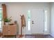 Bright entryway featuring a coat rack, stylish cabinet, and a clean, modern design at 1015 Fox Hill Dr, Indianapolis, IN 46228