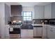Modern kitchen features stainless steel appliances, stylish countertops, and ample cabinet space, combining form and function at 1015 Fox Hill Dr, Indianapolis, IN 46228